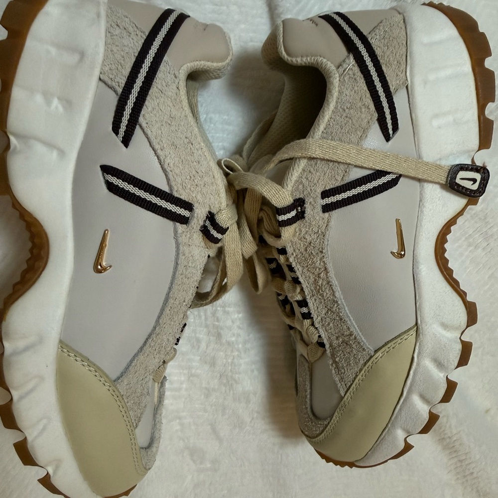 Jacquemus Beige and White Sneakers with Gold Accents
